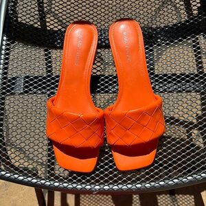 Orange basket weave slides mules